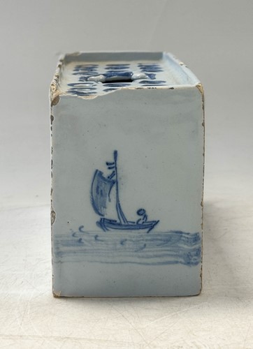 Lot 285 - A Delft blue and white flower brick, circa 1750