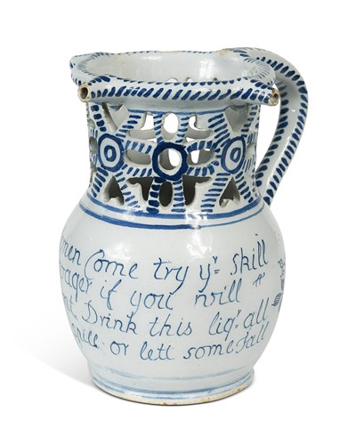 Lot 417 - A tin glazed blue and white puzzle jug, 18th/19th century
