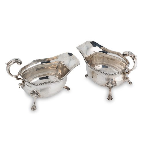 Lot 584 - Chester - A pair of George V silver sauce boats