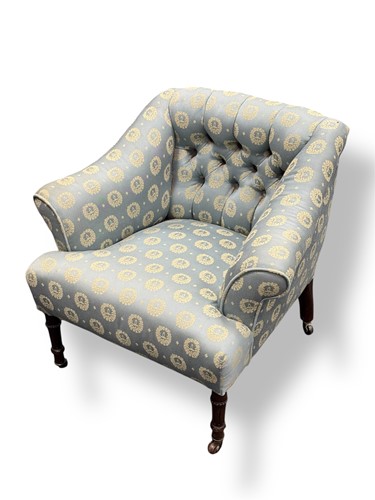 Lot 574 - A small Victorian fireside armchair with deep...