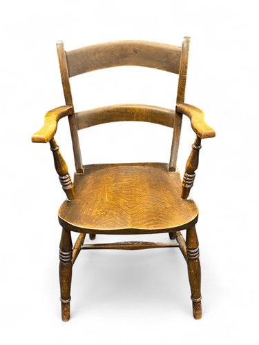 Lot 694 - A 19th century elm elbow chair