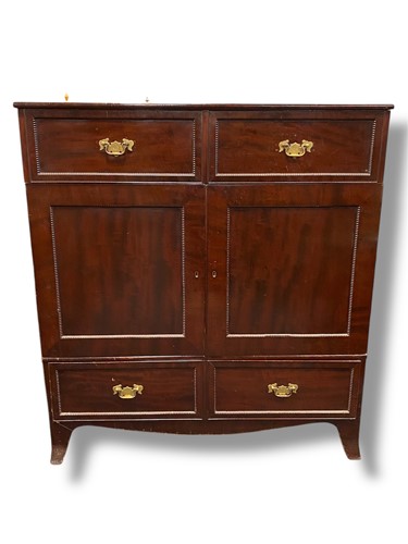 Lot 631 - A 19th century mahogany cupboard, in two parts,...