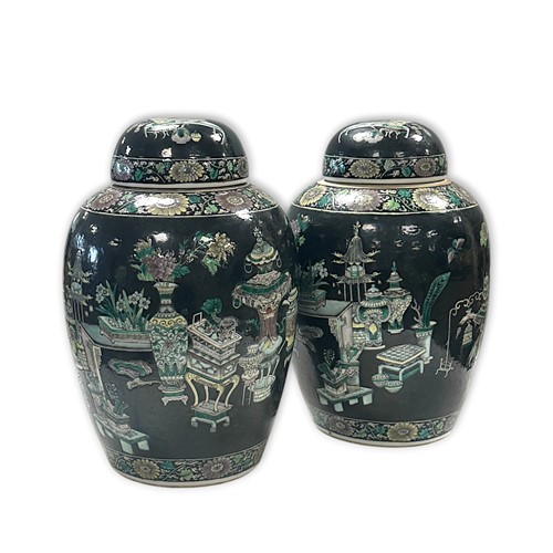Lot 33 - A pair of Chinese famille noire ginger jars and covers, circa 1900
