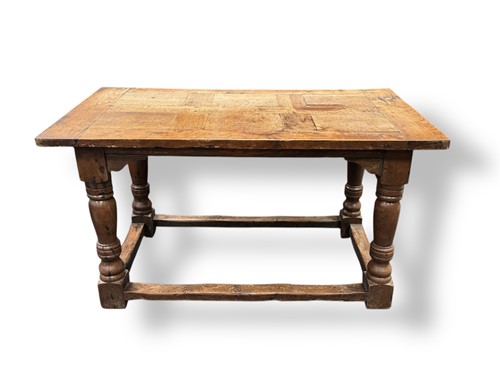 Lot 685 - A small oak refectory table, containing some...