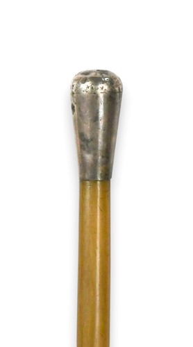 Lot 73 - A silver coloured metal mounted rhino horn swagger stick, circa 1910