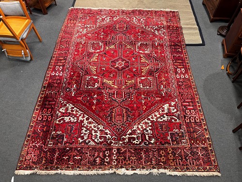 Lot 786 - A Heriz carpet, of typical geometric design on...
