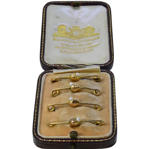 Lot 5 - A cased set of four seed pearl brooches