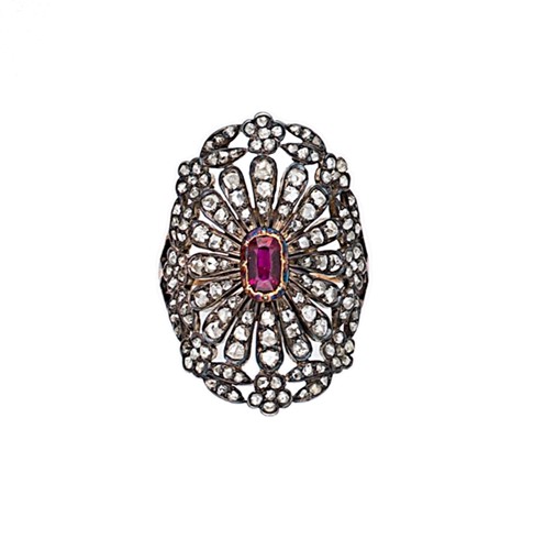 Lot 87 - A ruby and diamond cluster ring
