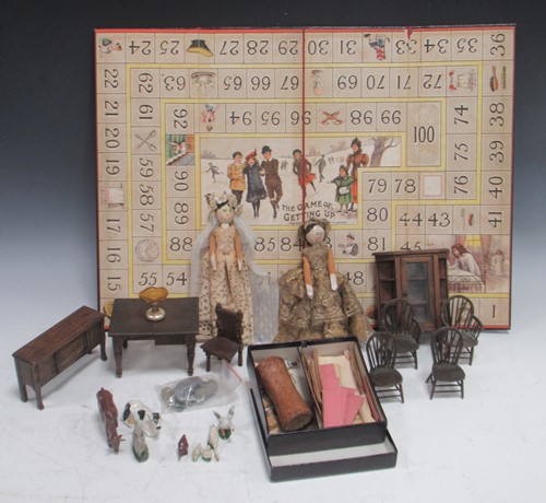 Lot 153 - A collection of toys, to include two peg dolls,...