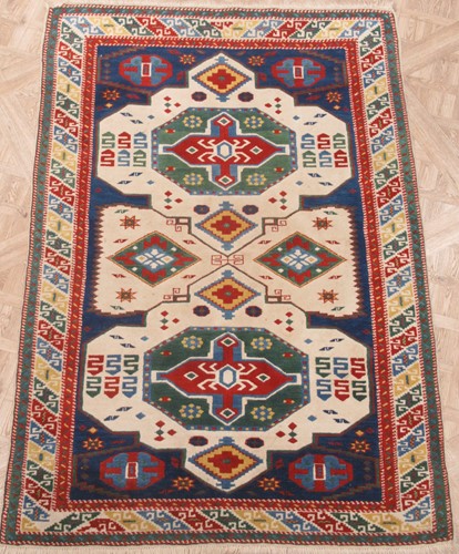 Lot 772 - A modern Kazak style rug with a brightly...