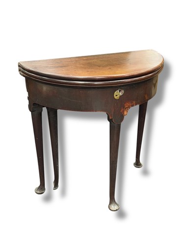 Lot 721 - George II mahogany fold over card table