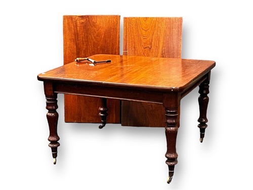 Lot 619 - A Victorian extending dining table with two...