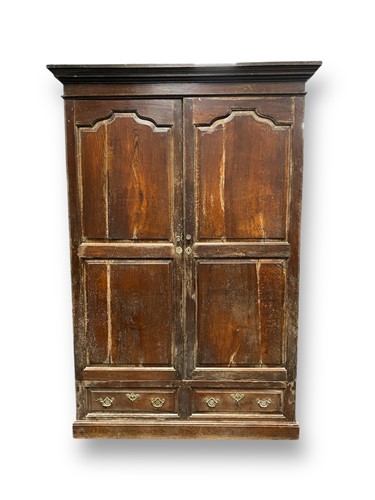 Lot 649 - An 18th century oak cupboard, the fielded...