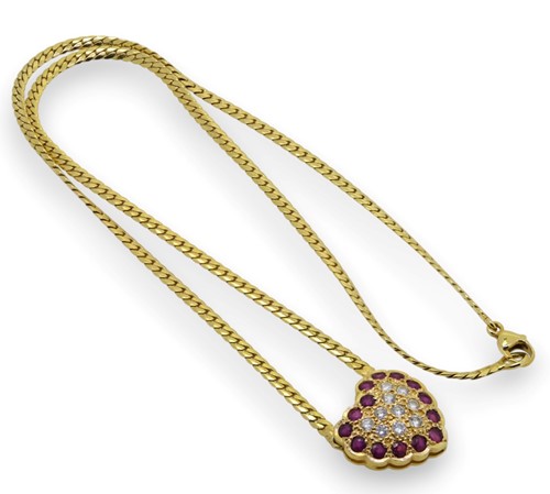 Lot 94 - An 18ct gold ruby and diamond heart necklace