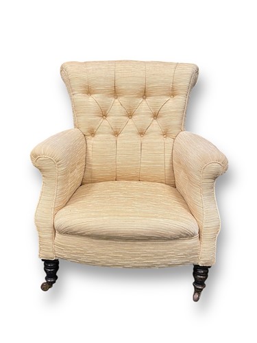 Lot 705 - An Edwardian buttonback armchair with ebonised...