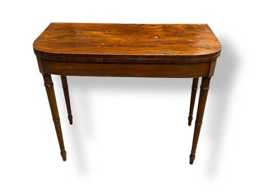Lot 743 - A Regency rosewood demi-lune card table raised...
