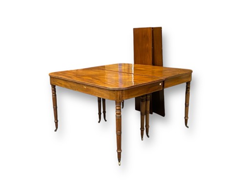Lot 707 - A Regency mahogany extending D-end dining...