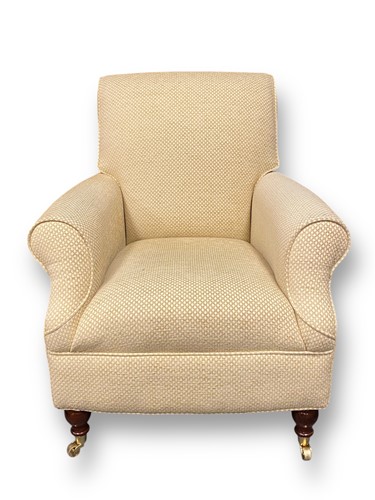 Lot 742 - A modern armchair upholstered in cream fabric...