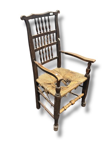 Lot 654 - A 19th century high backed armchair with...