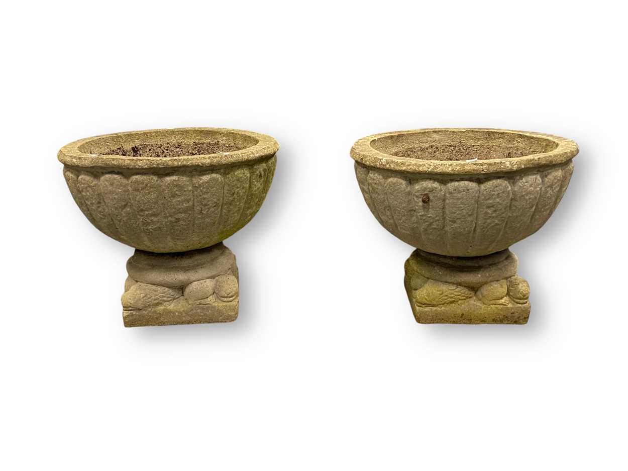 Lot 793 - A pair of composite stone garden planters, the...