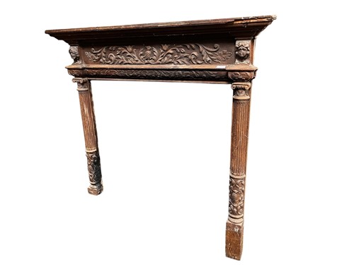 Lot 635 - A carved wood mantel or fire surround with...