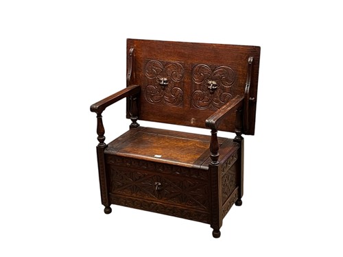Lot 732 - A Victorian carved oak monks bench,  76 x 94 x...