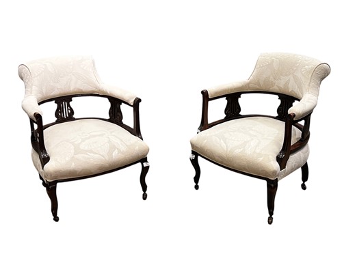 Lot 737 - A pair of Edwardian dark stained tub armchairs,...