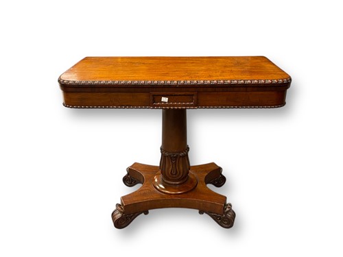 Lot 597 - An early 19th century mahogany card table with...