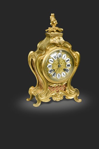 Lot 587 - A French Rococo style ormolu mantel clock, late 19th century