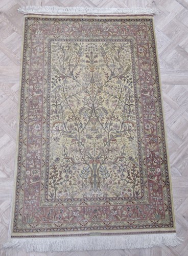 Lot 774 - Three small rugs including: a silk Tree of...