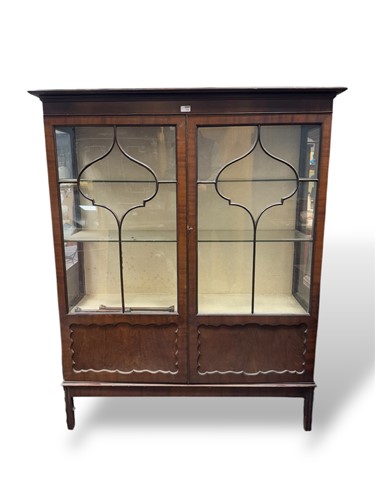 Lot 585 - An Edwardian part glazed mahogany bookcase,...