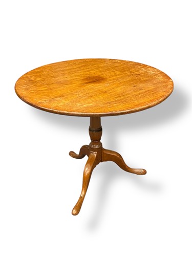 Lot 703 - A George III oak tripod table, the circular...