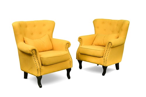 Lot 765 - A pair of modern button back easy chairs with yellow upholstery
