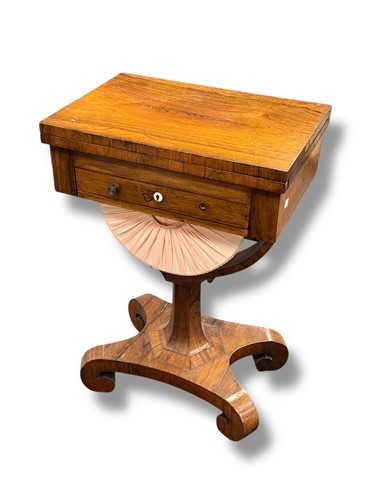 Lot 712 - A Regency rosewood work table with foldover...