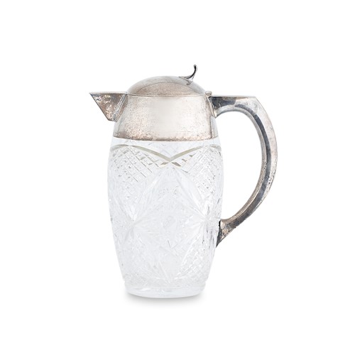 Lot 397 - A German metalwares silver and cut glass lemonade jug