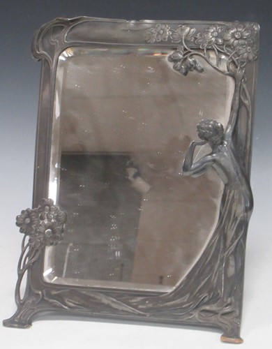 Lot 163 - An Art Nouveau alloy or pewter strut frame...