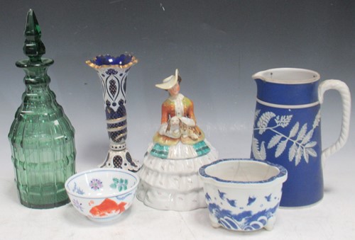 Lot 103 - An overlaid blue glass vase, a green glass...