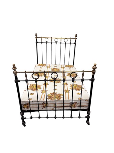Lot 627 - A Victorian brass and black painted frame...