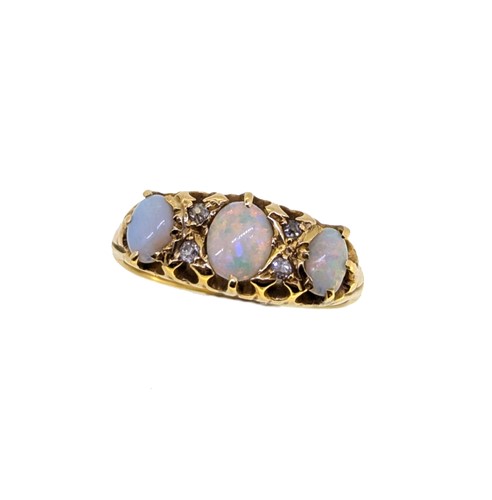 Lot 55 - An 18ct gold opal and diamond ring