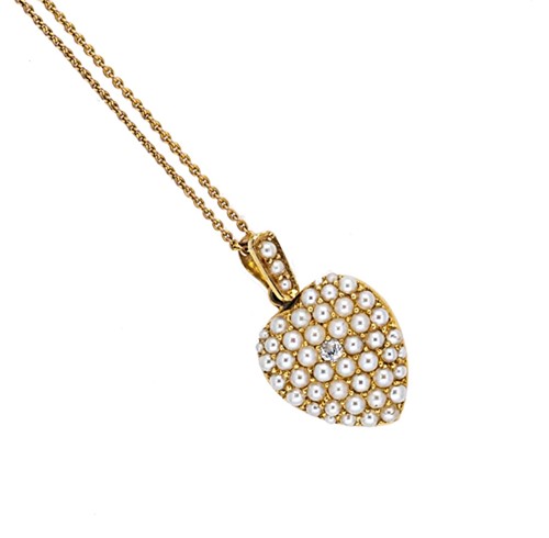 Lot 49 - A split pearl and diamond set heart shaped locket and chain