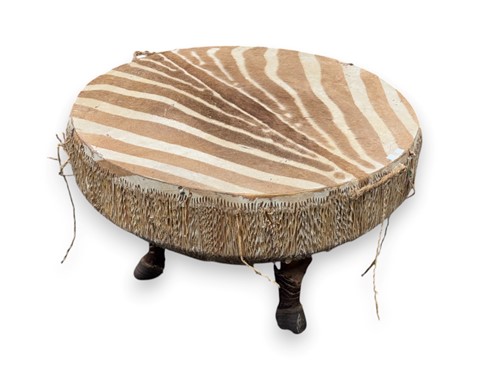 Lot 776 - A mid 20th century Zebra skin circular table,...