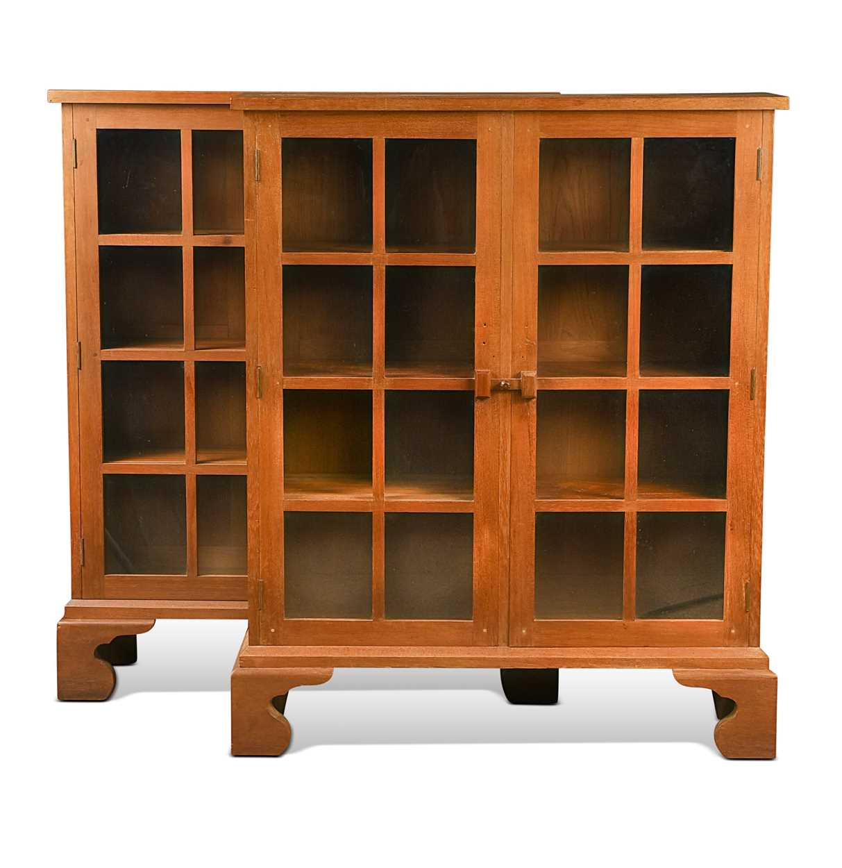 Lot Arthur Romney Green (1872-1945), a rare pair of Cotswold School glazed oak bookcases, circa 1925