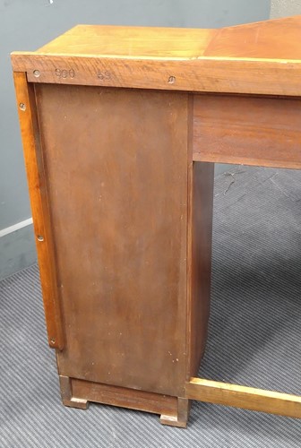 Lot 235 - A Heal's walnut corner desk, circa 1930
