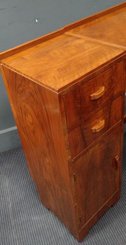 Lot 235 - A Heal's walnut corner desk, circa 1930