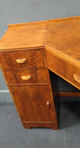 Lot 235 - A Heal's walnut corner desk, circa 1930