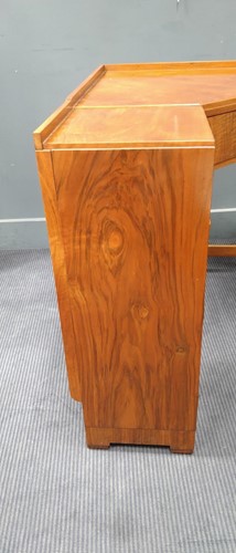 Lot 235 - A Heal's walnut corner desk, circa 1930