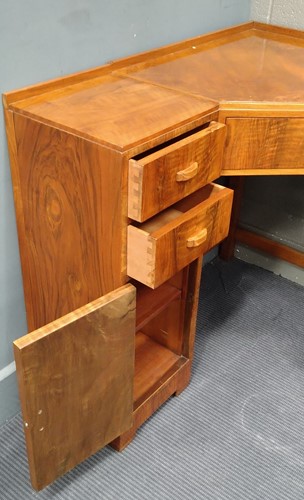 Lot 235 - A Heal's walnut corner desk, circa 1930