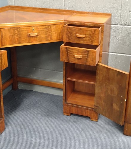 Lot 235 - A Heal's walnut corner desk, circa 1930