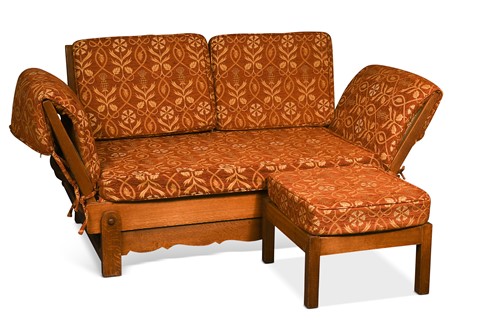 Lot 208 - A Heal's oak drop-end sofa or daybed and footstool by Parker Knoll, circa 1930