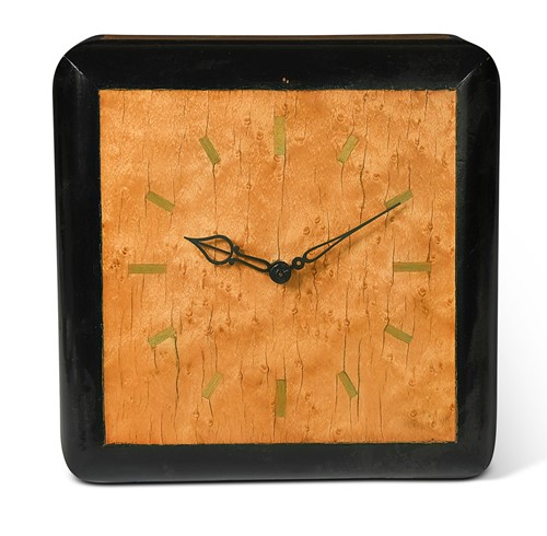 Lot 137 - An Art Deco maple and ebonised electric clock